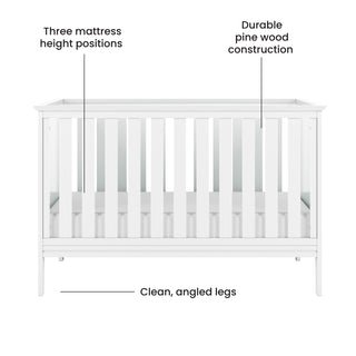 The Child Craft Atwood 3-in-1 Euro Convertible Crib in Matte White features slatted sides, three adjustable mattress height positions, durable pine wood construction, and modern angled legs.