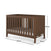 The Child Craft Kieran 3-in-1 Convertible Crib in Toasted Chestnut features vertical slats and includes a white mattress. Dimensions: 137cm (L) x 75cm (W) x 89cm (H). Shown empty for display.