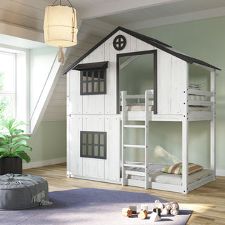 The Child Craft Modern Farmhouse Twin Over Twin Bunk Bed in white and black features a playhouse design with black windows and a ladder, shown in a bright room with green walls, a rug, a plant, and a soft hanging light.