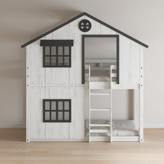 The Child Craft Modern Farmhouse Twin Over Twin Bunk Bed in White/Black features a house-inspired design with black-framed windows, a ladder, and peaked roof, set against a beige wall on a wooden floor.
