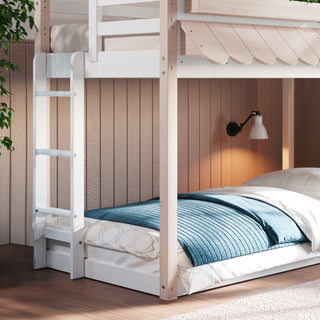 The Child Craft Garden Cottage Twin over Twin Bunk Bed features a white frame, light bedding, and blue blanket beside a wall-mounted lamp and wooden ladder. Wood-paneled walls and a leafy plant bring warmth to the space.