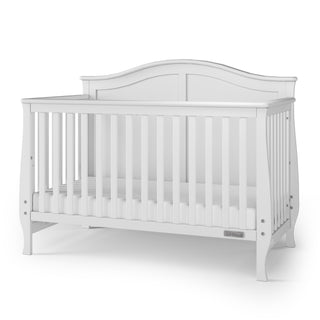The Child Craft Camden 4-in-1 Convertible Crib in Matte White features a slatted wooden frame and arched back panel, shown standing on a plain surface with a white background.