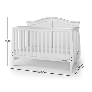 The Child Craft Camden 4-in-1 Convertible Crib in Matte White features a curved headboard, vertical slats, and measures 44.25"H x 55.25"W x 30.75"D. This versatile crib adapts as your child grows.