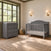 A gray Child Craft Camden 2-Piece Nursery Set With Crib and Dresser consisting of a convertible crib and a matching three-drawer dresser with a changing table topper.