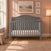 Cool Grey Child Craft Camden 4-in-1 convertible crib with an arched headboard.