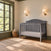 Child Craft Camden 4-in-1 Convertible Crib in cool grey with a curved headboard.
