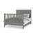 The Child Craft F06401 Full-Size Bed Rail in Lunar Gray features sturdy wooden rails, a slatted footboard, chevron-patterned headboard, and is compatible with a crib conversion kit; shown with white and gray bedding.