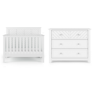 The Child Craft Atwood 4-in-1 Convertible Crib in Matte White stands beside a matching three-drawer dresser with a chevron pattern and round knobs, both displayed against a white background.