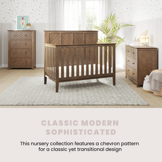 A nursery with the Child Craft Atwood 4-in-1 Convertible Crib in Cocoa Bean, a matching dresser and changing table with chevron pattern, light rug, plants, toys, and soft patterned wallpaper. Text: Classic Modern Sophisticated.