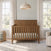 Child Craft Atwood 4-in-1 Convertible Crib in Cocoa Bean with a herringbone-patterned headboard, vertical slatted sides, and baby-safe finishes.