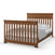 The Child Craft Redmond 4-in-1 Convertible Crib in Coach Cherry features vertical slats on the headboard and footboard, shown with neatly arranged white pillows, white sheets, and a gray blanket.