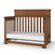 The Child Craft Redmond 4-in-1 Convertible Crib in Coach Cherry features slatted sides, a solid headboard, and classic style, shown with a white mattress.