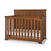 The Child Craft Redmond Full Panel 4-in-1 Convertible Crib in Coach Cherry features vertical slats, a high headboard, black corner accents, and includes a white mattress—ideal for a stylish nursery.