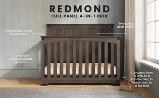 The Child Craft Redmond Full Panel 4-in-1 Convertible Crib in Dapper Gray features a full-panel headboard, sweeping arch design, and metal accents, showcased in a softly lit nursery with text highlighting its versatile design.