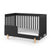 The Child Craft Park Heights 4-In-1 Euro Crib in Caviar Black showcases mid-century style with vertical slats, partial guardrail, white mattress, and light wooden legs, all set against a plain white background.