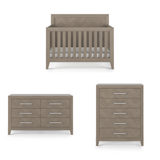 The Child Craft Kieran collection in Crescent Gray features a modern 4-in-1 convertible crib with slatted sides, a six-drawer dresser, and a five-drawer chest, all with silver handles for a coordinated nursery set.