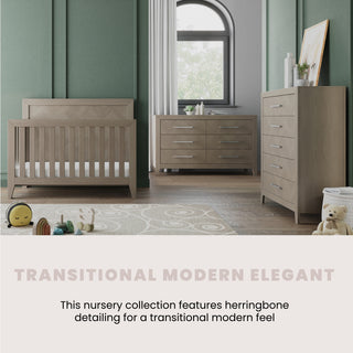 A stylish nursery with the Child Craft Kieran 6-Drawer Double Dresser in Crescent Gray, a wooden crib and chest of drawers with herringbone accents, green walls, plush toys, a cozy rug, and framed art for a warm atmosphere.