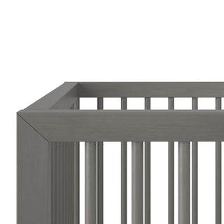 Close-up of the Child Craft Cranbrook 4-in-1 Convertible Crib in Lunar Gray, highlighting its slatted sides and sleek, modern finish—an ideal, timeless piece of nursery furniture.