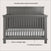 The Child Craft Denman 4-in-1 Convertible Crib in Midnight Gray features durable pine wood, a paneled headboard, clean straight legs, slatted sides, two mattress positions, and includes a white mattress.