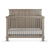 The Child Craft Denman 4-in-1 Convertible Crib in Crescent Gray features vertical slats, a high back panel, and comes with a white mattress, displayed against a white background.