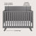 The Child Craft Soho 4-in-1 Flat Top Convertible Crib in Cool Gray features three adjustable mattress heights, sturdy pine wood construction, and angled legs—ideal for a stylish nursery. Arrows highlight its adjustable height, durable build, and modern leg design.