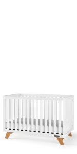 The Child Craft Soho 4-in-1 Convertible Crib in White/Natural features slatted sides, wooden legs, and a minimalist design, shown against a plain white background.