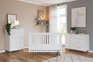 A modern nursery featuring the Child Craft Soho 4-in-1 Convertible Crib in White/Natural, with coordinating white furniture, shelves filled with books and toys, animal wall art, and a large window for natural light.