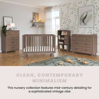 A nursery styled with modern wooden furniture, featuring the Child Craft Soho 4 Drawer Chest in Dusty Heather, a crib, dresser, and bookshelf, set against botanical print wallpaper and cozy decor. Text below: Clean, contemporary minimalism.