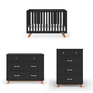 Three black nursery pieces with light wood legs: the Child Craft Soho 4-in-1 Convertible Crib in Ebony, a wide dresser with two small and two large drawers, and a tall chest with three drawers—all in mid-century modern style.