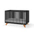 The Child Craft Soho 4-in-1 Convertible Crib in Ebony features wooden angled legs, vertical slats on all sides, and a white mattress. It converts into a toddler bed and is shown against a plain white background.