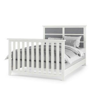The Child Craft Full-Size Bed Rails in white and brown feature sturdy construction and a headboard with vertical slats and gray paneling, shown neatly made with gray and white bedding and pillows.