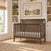 Dapper Gray Child Craft Scout 4-in-1 Convertible Crib with a paneled beadboard headboard and footboard.