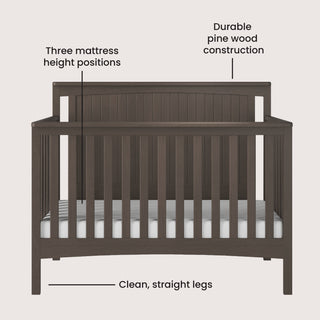 The Child Craft Scout 4-in-1 Convertible Crib in Dapper Gray features clean, straight legs, sturdy pine wood construction, and three mattress height positions—a versatile and stylish centerpiece for any baby nursery.