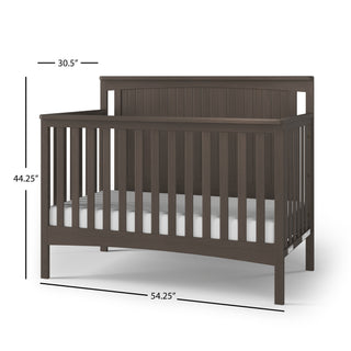The Child Craft Scout 4-in-1 Convertible Crib in Dapper Gray features vertical slats, a high beadboard headboard, adjustable mattress support, and includes a white mattress. Dimensions: 30.5"D x 54.25"W x 44.25"H.