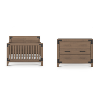 The Child Craft Lucas 4-in-1 Convertible Crib in Dusty Heather with vertical slats and dark corner accents is displayed beside a matching three-drawer dresser, both set against a white background.
