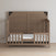 The Child Craft F09514 Toddler Guard Rail in Dusty Heather features sturdy wood construction with slatted sides and an open front, a high back panel, and is displayed against a plain light wall on a light wood floor.