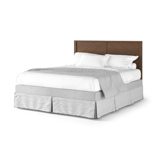 The Surrey Hill 4-in-1 Convertible Crib by Child Craft in Toasted Chestnut features a brown wooden headboard, white bedding and pillows, a light gray blanket, and a matching bed skirt set against a white background.