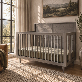 Lunar Gray Child Craft Surrey Hill 4-in-1 Convertible Crib with a paneled headboard featuring an X-shaped design.