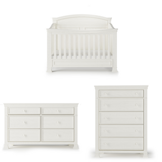 The Child Craft Westgate 4-in-1 Convertible Crib in Vintage Linen is shown with a six-drawer dresser on the left and a five-drawer chest on the right, all in classic white nursery style against a white background.