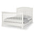 The Child Craft Westgate 4-in-1 Convertible Crib in Vintage Linen features a high headboard, matching footboard with vertical slats, adjustable mattress support, and comes neatly made with white and gray bedding.