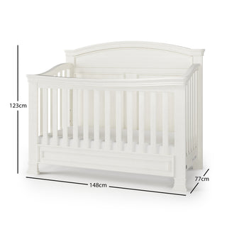 The Child Craft Westgate 4-in-1 Convertible Crib in Vintage Linen features vertical slats, an arched back panel, adjustable mattress support, and measures 123H x 148W x 77D cm. Crib stands securely on a flat surface.