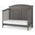 The Child Craft Westgate 4-in-1 Convertible Crib in Chelsea Grey features an arched headboard, solid panel back, slatted sides, white mattress, and adjustable support for toddler bed use.