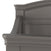 Close-up of the upper corner of the Child Craft Westgate 4-in-1 Convertible Crib in Chelsea Grey, highlighting its curved edges and detailed raised panel design on the headboard.