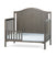 The Child Craft Toddler Guard Rail in Dapper Gray features sturdy wood construction with an arched headboard and vertical side slats, shown with a light blue patterned mattress.