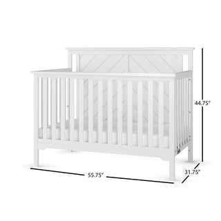 The Child Craft Hampton Flat Top 4-in-1 Convertible Crib in matte white features slatted sides, a high paneled headboard, non-toxic finish, sturdy pine wood, and measures 55.75"W x 31.75"D x 44.75"H.