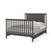 The Child Craft Hampton Flat Top 4-in-1 Convertible Crib in Dapper Gray features a dark wood finish, vertical slats on the headboard and footboard with a chevron headboard pattern, styled with neatly made white and gray bedding.