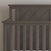 A close-up of the Child Craft Hampton Flat Top 4-in-1 Convertible Crib in Dapper Gray, featuring vertical slats and a diagonal slat pattern on the headboard, set against a light-colored wall.