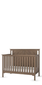 The Child Craft Hampton Flat Top 4-in-1 Convertible Crib in Dusty Heather features vertical slats and a solid chevron-patterned headboard, shown on a white background. This crib easily adapts as your child grows.