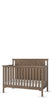 The Child Craft Hampton Flat Top 4-in-1 Convertible Crib in Dusty Heather features vertical slats and a solid chevron-patterned headboard, shown on a white background. This crib easily adapts as your child grows.