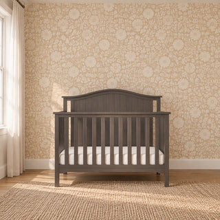 Child Craft Hampton Arch Top 4-in-1 Convertible Crib in Dusty Heather, featuring a sturdy pine wood arched headboard, adjustable mattress support, and a mattress.